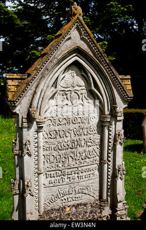 Gravestone with unusual writing in St. Andrew`s churchyard, Harlestone, Northamptonshire, England, UK Stock Photo